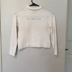 White Bebe crop top sweater.